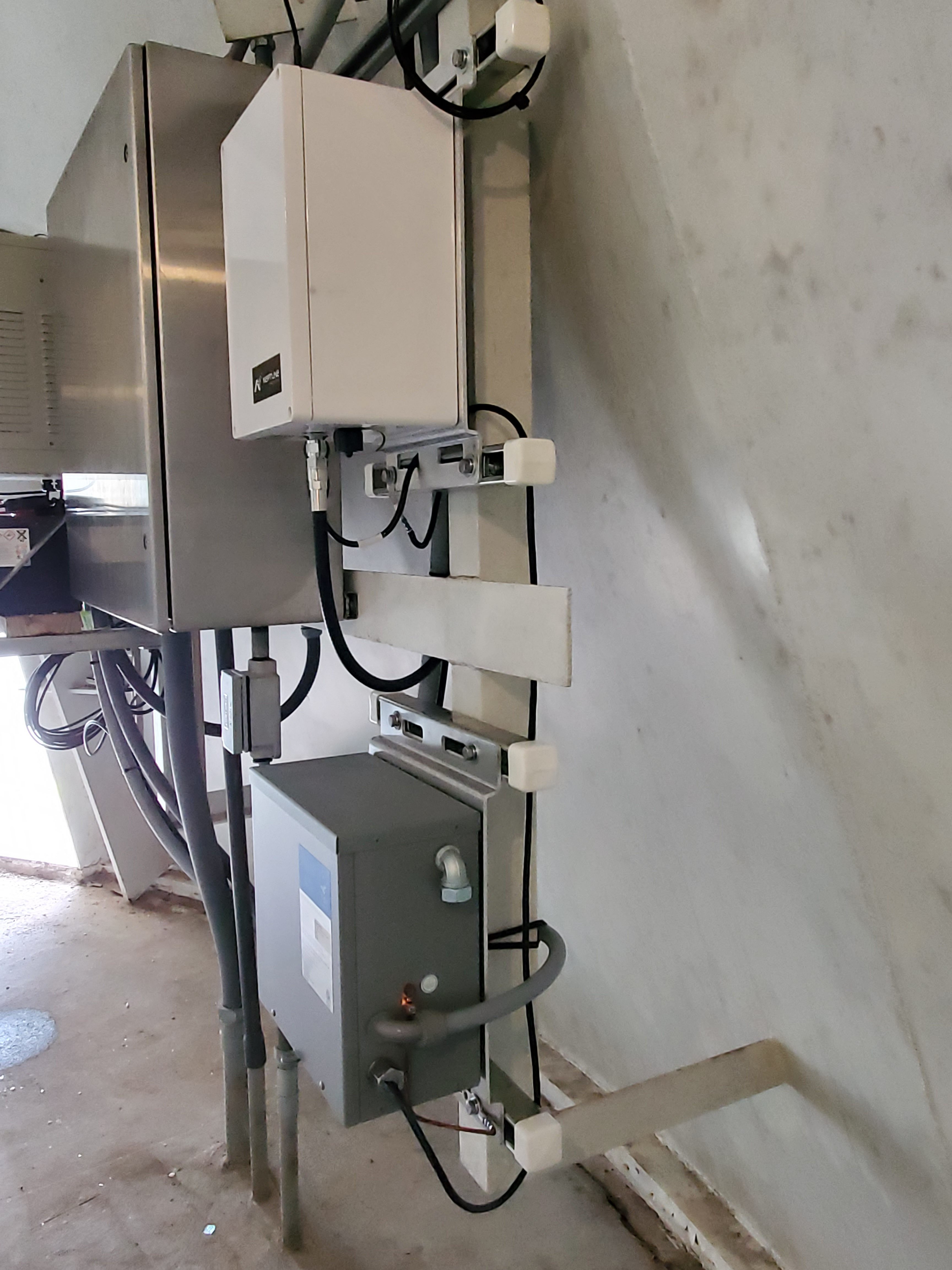 AMI gateway and battery backup mounted on rack in water tower